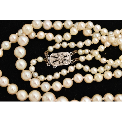 71 - A DOUBLE ROW CULTURED PEARL NECKLACE, double strand of graduated individually knotted cultured pearl... 