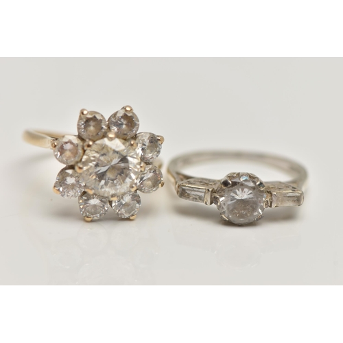 80 - TWO 9CT GOLD CUBIC ZIRCONIA SET RINGS, the first a circular cluster design, the second a three stone... 