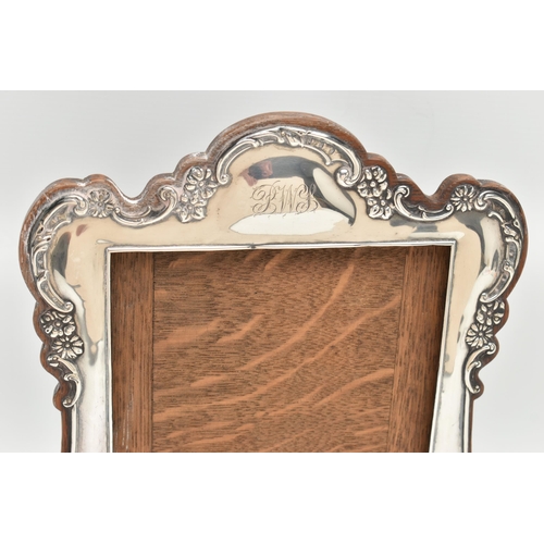 112 - A SILVER PHOTO FRAME AND PIN DISH, an AF silver fronted photo frame with monogram engraving, hallmar... 