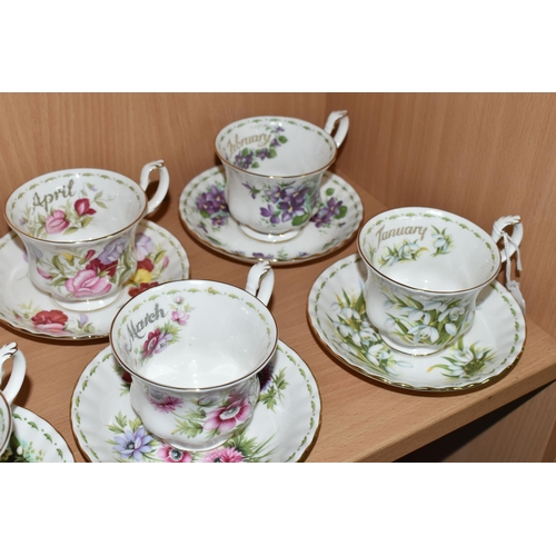 319 - A SET OF ROYAL ALBERT 'FLOWERS OF THE MONTH' TEA CUPS AND SAUCERS, twelve cups and saucers represent... 