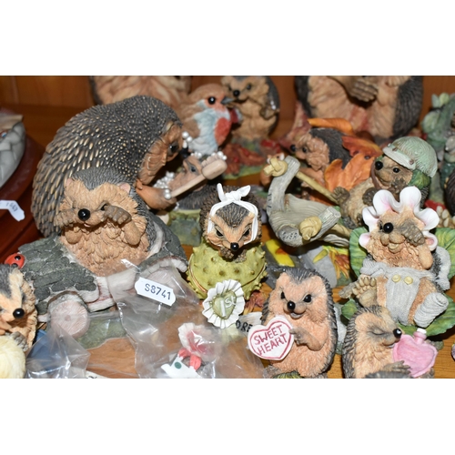 332 - A COLLECTION OF 'HEDGIES' HEDGEHOG RESIN FIGURES, in varying sizes, the largest 'Edward', height 25c... 