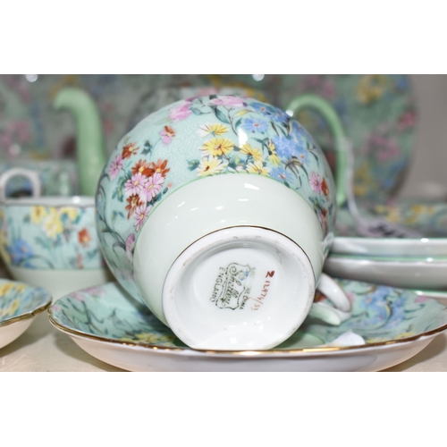 341 - EIGHTEEN PIECES OF SHELLEY 'MELODY' CHINTZ PATTERN TEA WARES, comprising a small tea pot, small milk... 