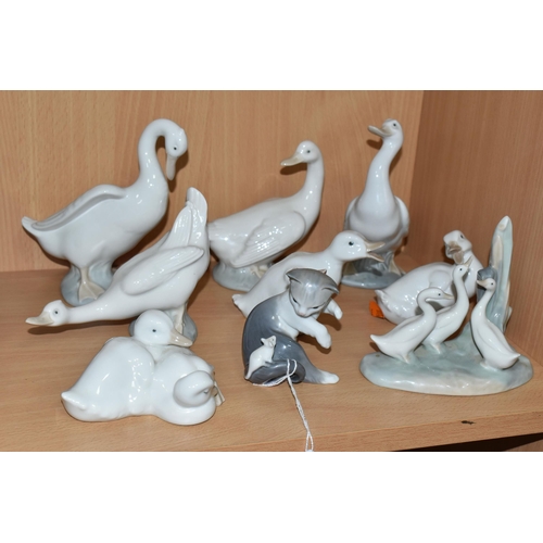 307 - A LLADRO CAT FIGURE AND EIGHT NAO DUCK FIGURES, to include Lladro Cat and Mouse, model no 5236, scul... 