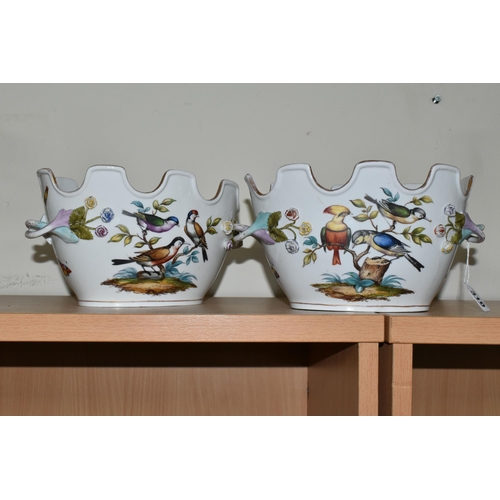 310 - A PAIR OF LATE 19TH / EARLY 20TH CENTURY CONTINENTAL PORCELAIN TWIN HANDLED CACHE-POT PLANTERS, the ... 