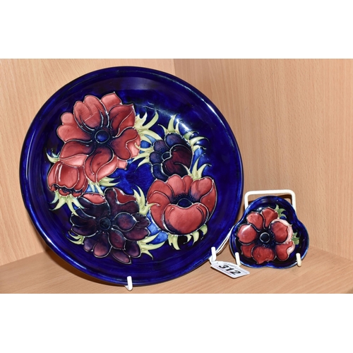 312 - A MOORCROFT POTTERY SHALLOW BOWL AND PIN DISH, both in the Anemone pattern, tube lined with red and ... 