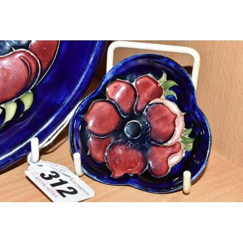 312 - A MOORCROFT POTTERY SHALLOW BOWL AND PIN DISH, both in the Anemone pattern, tube lined with red and ... 