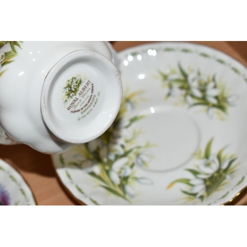 319 - A SET OF ROYAL ALBERT 'FLOWERS OF THE MONTH' TEA CUPS AND SAUCERS, twelve cups and saucers represent... 