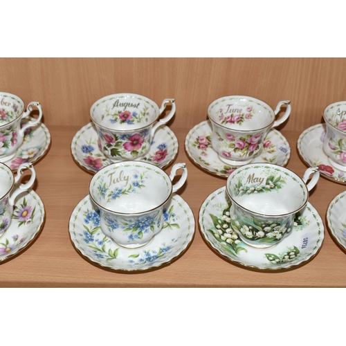 319 - A SET OF ROYAL ALBERT 'FLOWERS OF THE MONTH' TEA CUPS AND SAUCERS, twelve cups and saucers represent... 