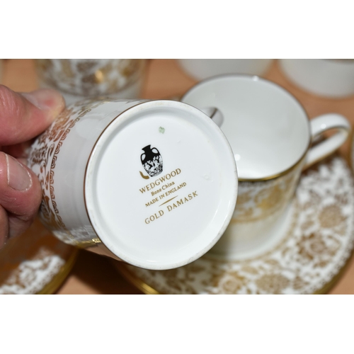 330 - A SMALL QUANTITY OF WEDGWOOD 'GOLD FLORENTINE' W4219 AND 'GOLD DAMASK' PATTERN PART DINNER WARES, th... 