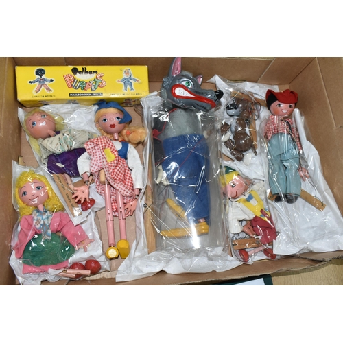 367 - A BOX OF PELHAM PUPPETS, seven puppets comprising Cowboy, Dutch Girl, Wolf, Pinocchio, Bengo and two... 