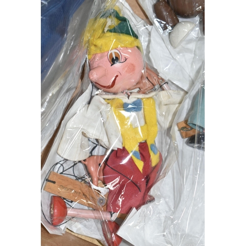 367 - A BOX OF PELHAM PUPPETS, seven puppets comprising Cowboy, Dutch Girl, Wolf, Pinocchio, Bengo and two... 