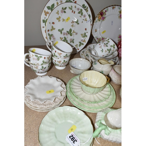 392 - A SELECTION OF NAMED CERAMIC ITEMS ETC, to include Belleek saucers, jugs and bowls, black and green ... 