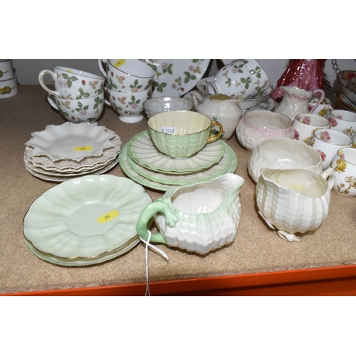 392 - A SELECTION OF NAMED CERAMIC ITEMS ETC, to include Belleek saucers, jugs and bowls, black and green ... 