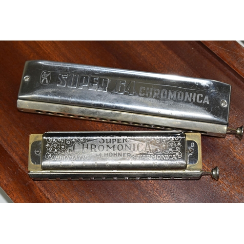 400 - A WOODEN CASE CONTAINING NINE HARMONICAS, comprising an M Hohner The 64 Chromonica, six The Super Ch... 