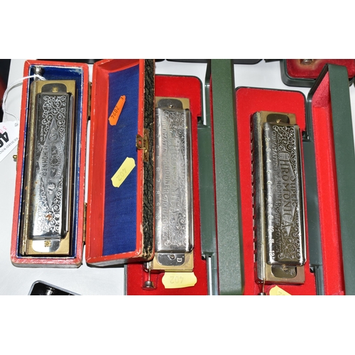 402 - A GROUP OF TEN CASED HOHNER HARMONICAS, comprising The 64 Chromonica professional model, a CX12, a C... 