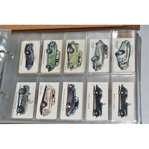 403 - TWO CIGARETTE CARD ALBUMS AND A BOX OF CIGARETTE CARDS containing a miscellaneous collection of sets... 