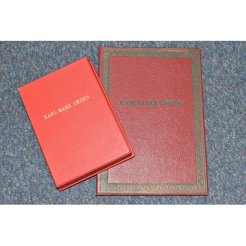 404 - A FOLDER AND A MEDAL BOX (empty) both embossed on the front with 'Karl Marx Orden'