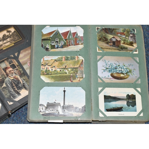 406 - TWO ALBUMS OF POSTCARDS containing approximately 501 early 20th century postcards, (with exceptions)... 