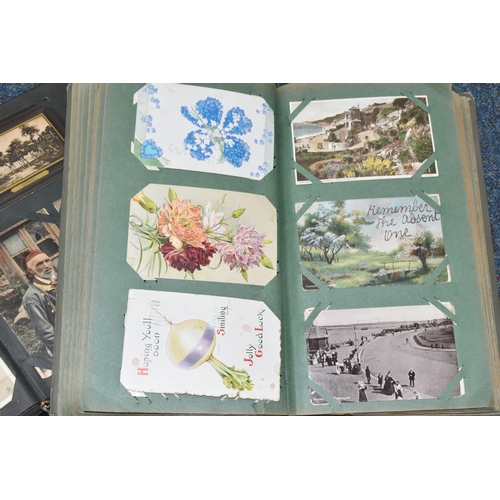 406 - TWO ALBUMS OF POSTCARDS containing approximately 501 early 20th century postcards, (with exceptions)... 