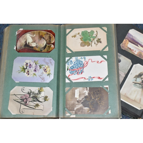 406 - TWO ALBUMS OF POSTCARDS containing approximately 501 early 20th century postcards, (with exceptions)... 