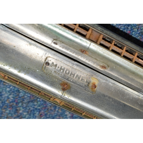 408 - A LONG DOUBLE HARMONICA, German made M. Hohner, length 59cm (1) (Condition Report: missing a few nut... 