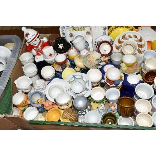 438 - EIGHT BOXES CONTAINING A LARGE COLLECTION OF CERAMIC EGG CUPS, to include over three hundred assorte... 