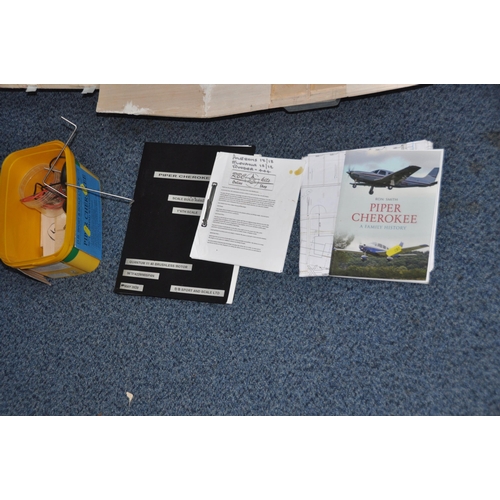 851 - A PIPER CHEROKEE MODEL PLANE, 64in wingspan partially built with spares, manuals and plans (without ... 