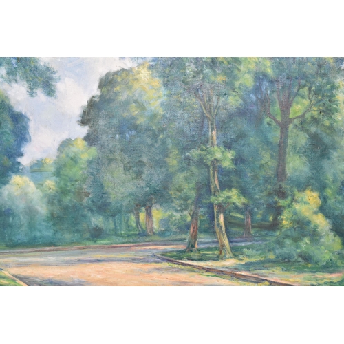 801 - H CLEMENT (20TH CENTURY) A FRENCH WOODLAND LANDSCAPE, a road leading to a junction cuts a path throu... 