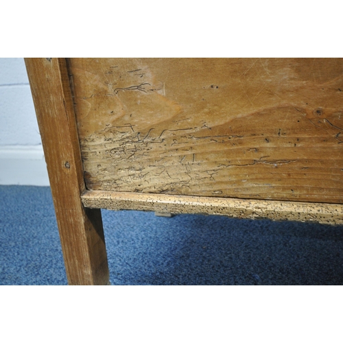 1248 - A 19TH CENTURY STYLE PINE HALL SETTLE, with foliate detail to back and sides and a single hinged sea... 