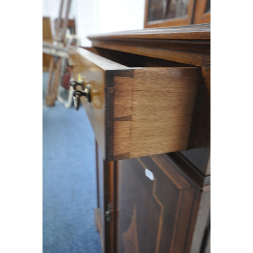 1253 - AN EDWARDIAN WALNUT AND INLAID BOOKCASE, the top with two glazed doors, enclosing two shelves, on a ... 