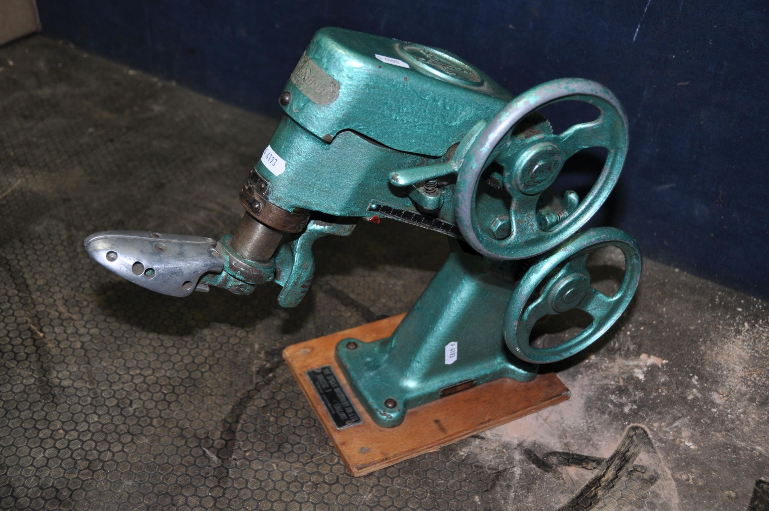 A VINTAGE EUPEDUS COBBLERS SINGLE SHOE STRETCHER with plaque to plinth ...