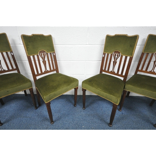 1315 - A SET OF SIX OAK ARTS AND CRAFTS CHAIRS, including two carvers, with green upholstery on turned fron... 