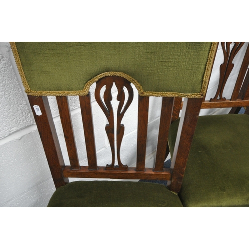 1315 - A SET OF SIX OAK ARTS AND CRAFTS CHAIRS, including two carvers, with green upholstery on turned fron... 