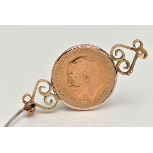 16 - A HALF SOVEREIGN BROOCH, the brooch mounted with a half sovereign, dated 1914, to the scrolling side... 