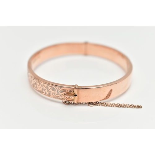 20 - A EARLY 20TH CENTURY HINGED BANGLE, to include a rose gold flat hinged bangle with embossed floral a... 