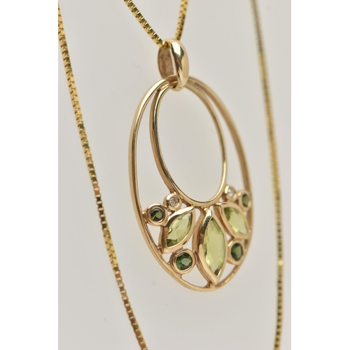 28 - A YELLOW METAL GEM SET PENDANT AND A 9CT GOLD CHAIN, the oval open work pendant set with three marqu... 
