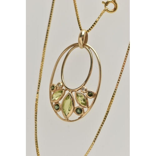 28 - A YELLOW METAL GEM SET PENDANT AND A 9CT GOLD CHAIN, the oval open work pendant set with three marqu... 
