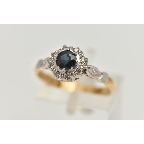 3 - AN 18CT GOLD SAPPHIRE AND DIAMOND CLUSTER RING, designed as a central circular sapphire within a sin... 