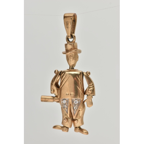 33 - A 9CT GOLD ARTICULATED MAN PENDANT, gentlemen holding a bottle with top hat on, set with blue paste ... 