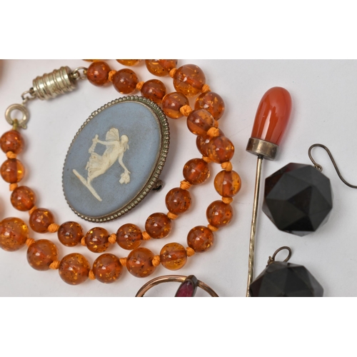 63 - A SMALL ASSORTMENT OF JEWELLERY, to include a plastic beaded necklace, a foliage paste brooch, an ag... 