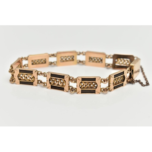 8 - AN EARLY 20TH CENTURY YELLOW METAL ELEPHANT HAIR BRACELET, comprised of nine rectangular form panels... 