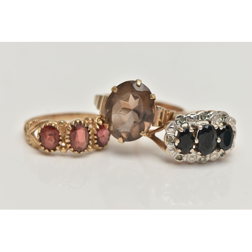 82 - THREE GEM SET RINGS, the first a sapphire and small diamond cluster ring, hallmarked 9ct Birmingham,... 
