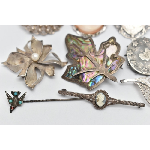 120 - ELEVEN BROOCHES AND A STICKPIN, to include a late Victorian silver circular brooch with butterfly an... 