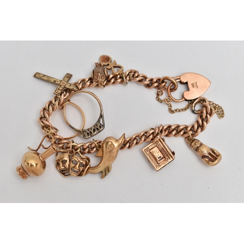 123 - A ROSE METAL CHARM BRACELET, a curb link bracelet, fitted with a heart padlock clasp, stamped 9ct, f... 