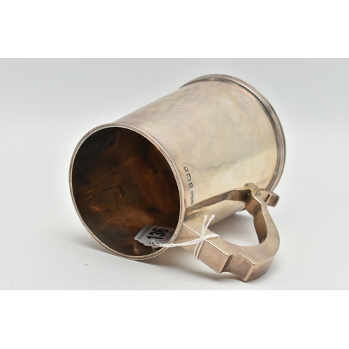 136 - A MID 20TH CENTURY SILVER TANKARD, polished tapered form fitted with a scroll handle, approximate he... 