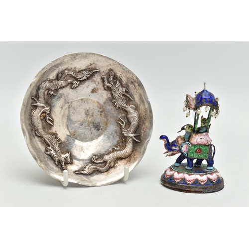 139 - A WHITE METAL DISH AND AN ENAMEL FIGURINE, circular dish decorated with two oriental dragons, unmark... 