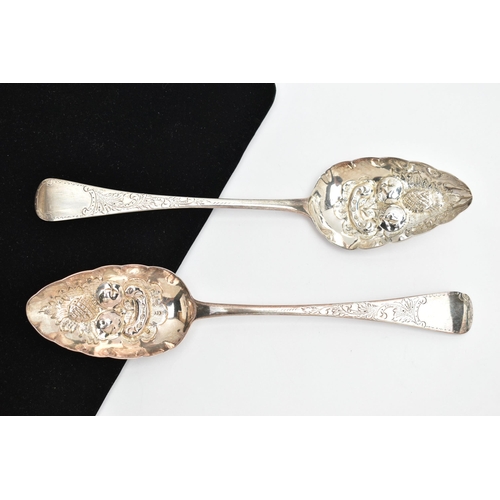 144 - A PAIR OF GEORGE III SILVER BERRY SPOONS, with later added embossed and engraved detail, hallmarked ... 