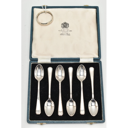 149 - A CASED SET OF SIX SILVER TEASPOONS AND A NAPKIN RING, teaspoons hallmarked Sheffield 1965, together... 