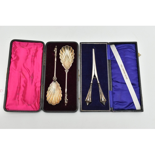 153 - CASED SILVER SPOONS AND GLOVE STRETCHERS, the pair of cased late Victorian silver spoons have shell ... 