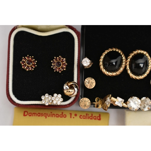 86 - A BAG OF ASSORTED EARRINGS, to include a pair of yellow metal garnet cluster stud earrings, post and... 